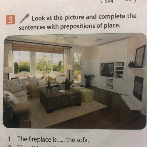 Look at the picture and complete the sentences with prepositions of place. 1 The fireplace is -- the